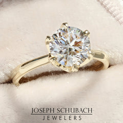 Style 102782: Round Cathedral Engagement Ring With A Six Prong Diamond Accent Crown Head