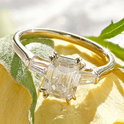 Emerald cut diamond with emerald side stones Clearance