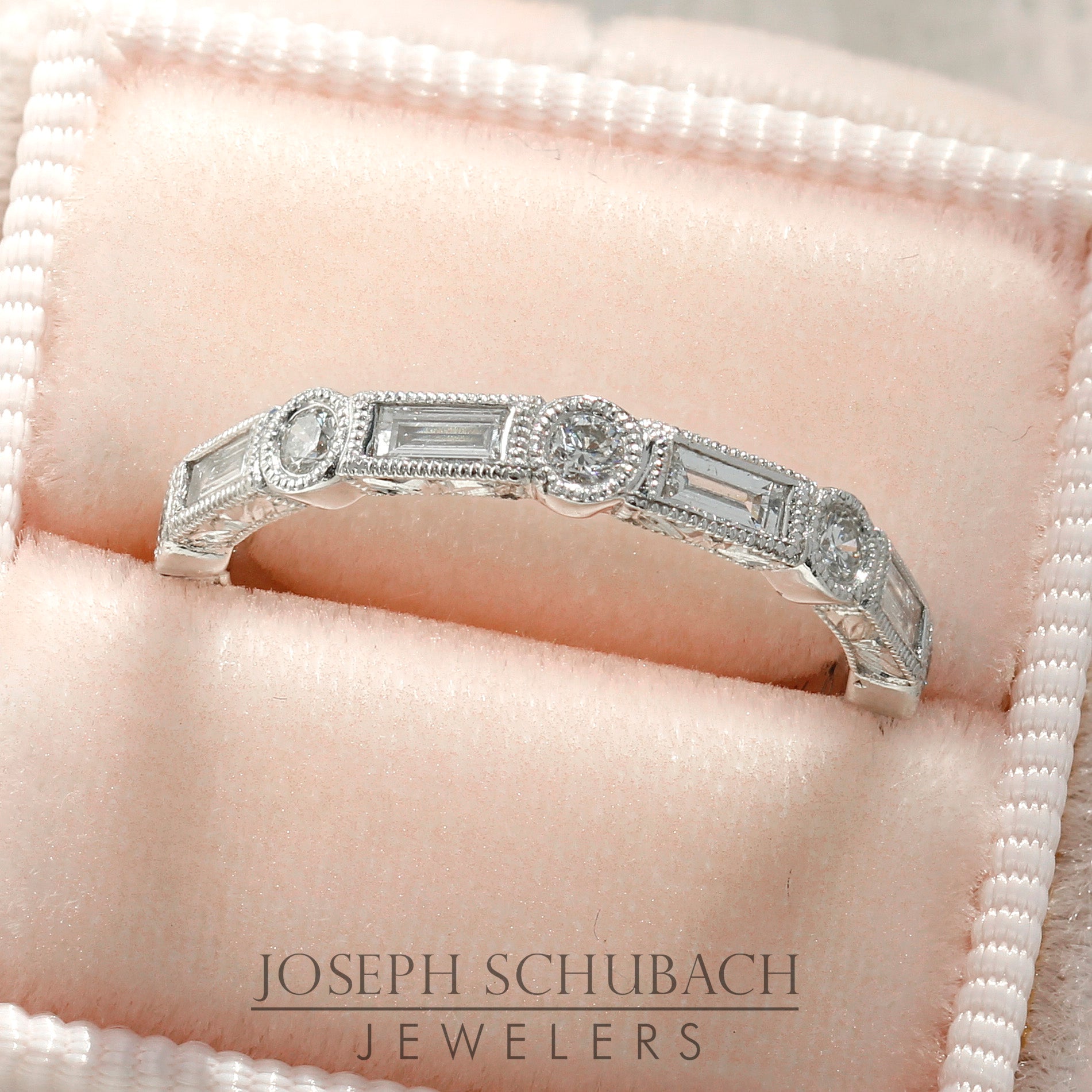 Style 103373: The Kate bezel set baguette and round diamond wedding band with hand engraving.