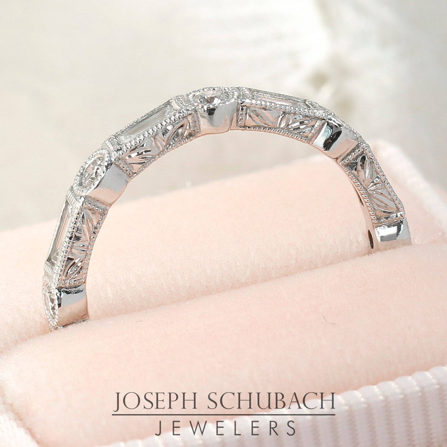 Style 103373: The Kate bezel set baguette and round diamond wedding band with hand engraving.