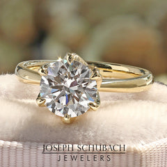 Style 102782: Round Cathedral Engagement Ring With A Six Prong Lab Diamond Accent Crown Head