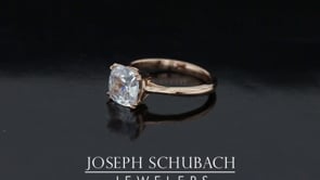 Style 102784: Low Profile Cushion Cathedral Engagement Ring With A Double Claw Prong Basket Head