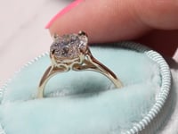 Style 102783: Round Scroll Solitaire Engagement Ring with a Surprise Diamond Accent