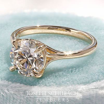 Style 102783: Round Scroll Solitaire Engagement Ring with a Surprise Diamond Accent