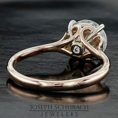 Style 102783: Round Scroll Solitaire Engagement Ring with a Surprise Diamond Accent