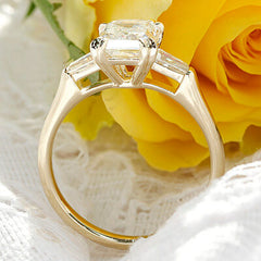 Style 103364: Manhattan Three Stone Emerald Cut Engagement Ring with Baguette Side Stones