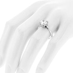 Style 102783: Round Scroll Solitaire Engagement Ring with a Surprise Diamond Accent