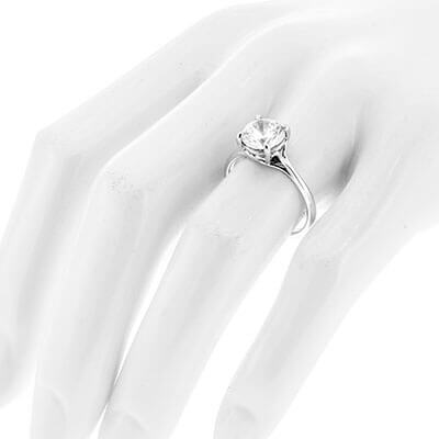 Style 102783: Round Scroll Solitaire Engagement Ring with a Surprise Diamond Accent