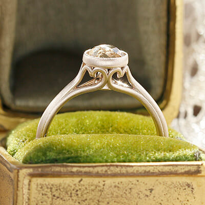 Style 103365: Bezel Set Scroll Solitaire Engagement Ring with Champagne Rose Cut Diamond