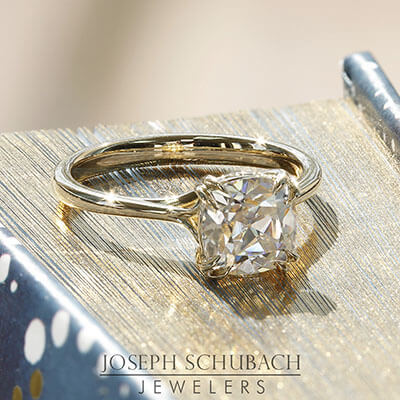 Style 104600: Scroll Solitaire for a cushion cut center stone