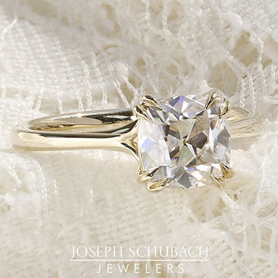 Style 104600: Scroll Solitaire for a cushion cut center stone